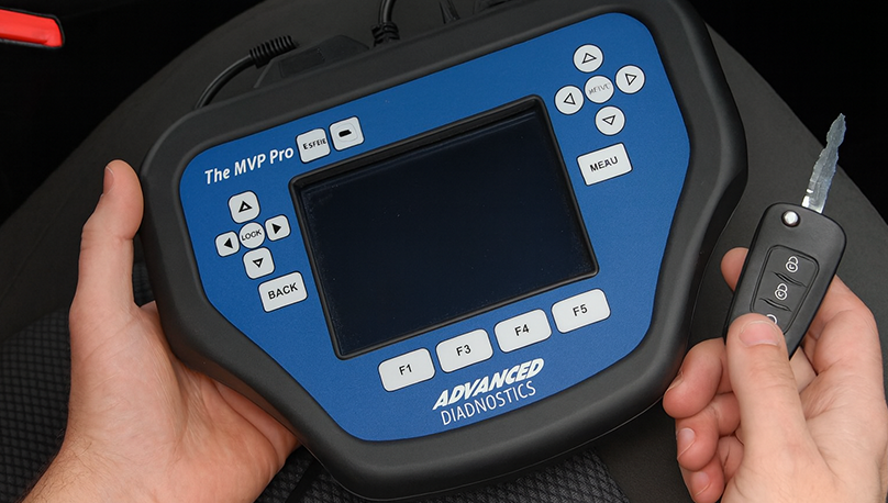 Locksmith performing on-site car key diagnostics and reprogramming