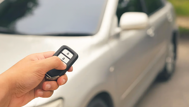 Mobile locksmith van providing car key replacement and lock change at customer’s home