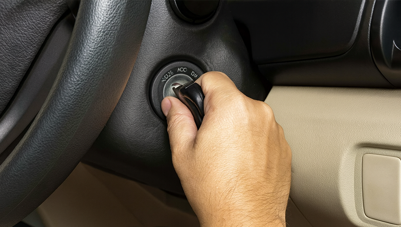 Locksmith technician programming car key fob on site
